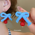 Red Coral Branch and Blue Bow Mismatched Stud Earrings view 3