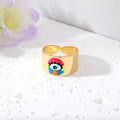 Gold Tone Wide Cuff Smiley and Lash Eye Adjustable Rings view 7