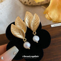 Textured Leaf Drop Earrings With White Faux Pearl Accents view 2