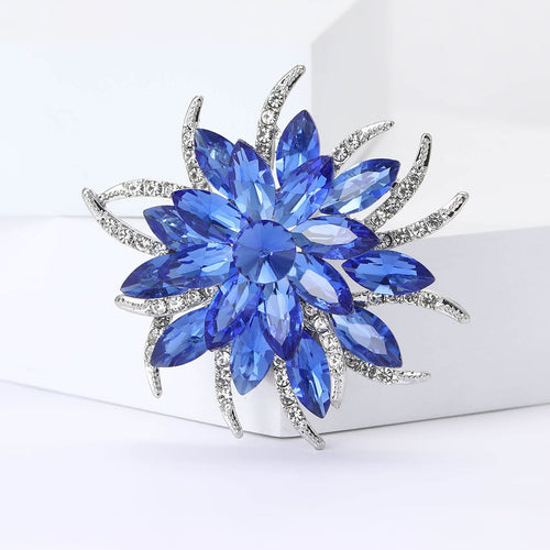 Angled close-up showing crystals on the layered crystal flower brooch