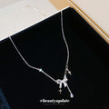Silver Tone Bow and Cross Charm Draped Necklace Fashion Jewelry view 2