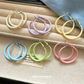 Color Coated Medium Hoop Earrings in White and Pink view 3