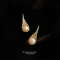Gold Teardrop Filigree Frame White Pearl Hook Earrings view 1