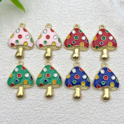 Colorful mushroom charms arranged on a light background