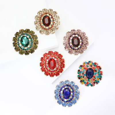 Front view of the large oval faceted glass crystal brooch in six colorways brooch and its color options