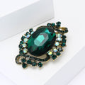 Large Oval Crystal Scroll Brooch in Six Jewel Tone Colors view 3