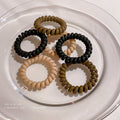 Black Matte Telephone Cord Spiral Coil Hair Tie With Thick Profile view 2