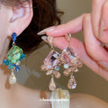 Faceted Crystal Floral Drop Stud Earrings with Polished Metal Tone Details view 1
