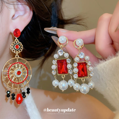 Close view of the colors and surface details on vintage pearl circle and rectangle stud earrings