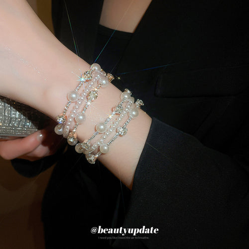 three mixed multirow pearl-like crystal open cuffs in gold-tone and silver-tone finishes shown worn in a styled second v