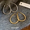 Slim Oval Statement Hoop Earrings in Gold and Silver Tones view 4