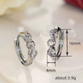 Silver Tone Five Graduated Clear Stone Huggie Hoop Earrings view 4
