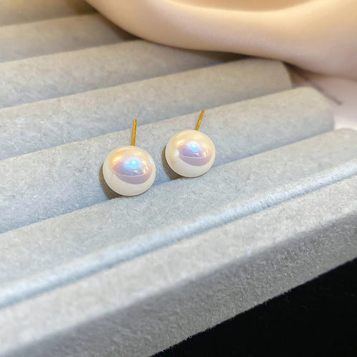 Front view of round pearl stud earrings in four colors and sizes