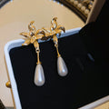 Gold Tone Bow And White Teardrop Pearl Drop Earrings view 6