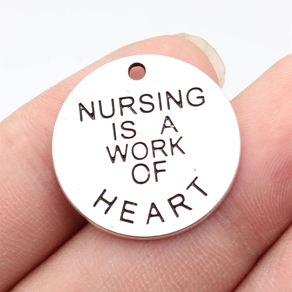 25x25x1.5mm 4.2g Antique Silver Zinc Alloy Nursing Is A Work Of Heart Round Tag Charm Pendant for DIY Jewelry