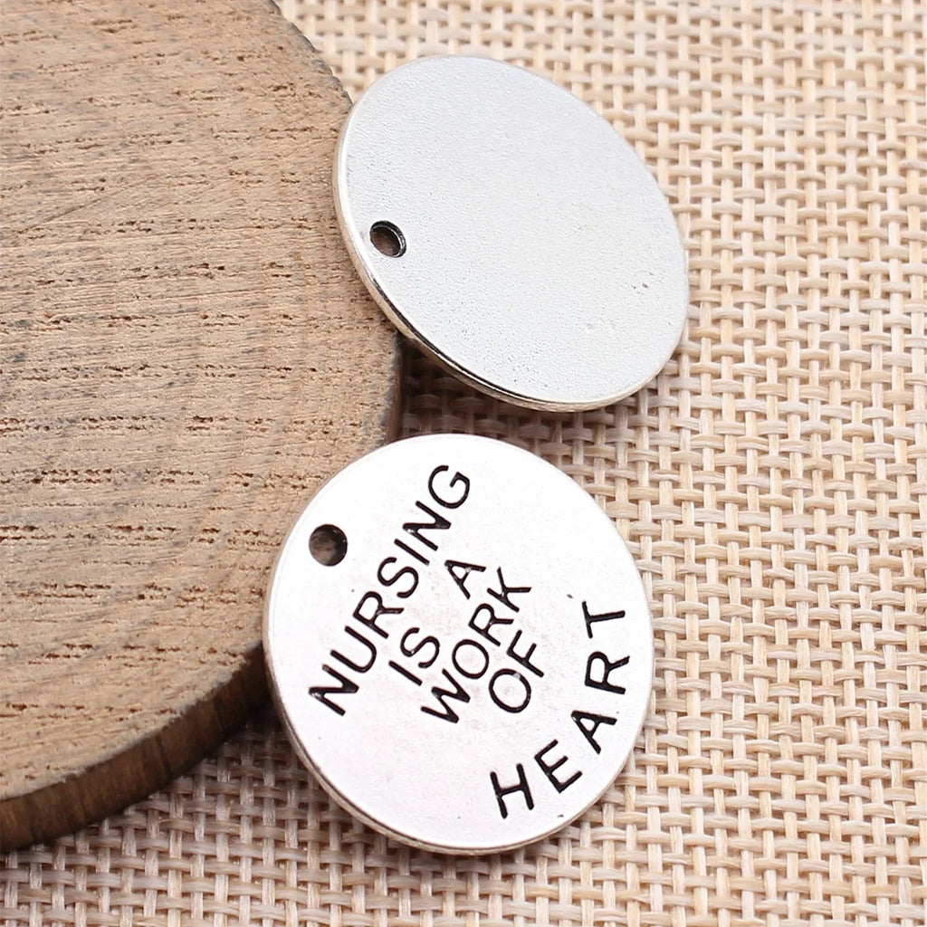 25x25x1.5mm 4.2g Antique Silver Zinc Alloy Nursing Is A Work Of Heart Round Tag Charm Pendant for DIY Jewelry