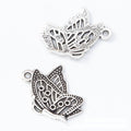 Antique Butterfly Resting on Hand Metal Charm, Two Finishes view 6